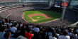 © Andres Mejia - Huge crowd of baseball fans is watching a baseball game in a stadium