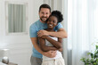 © New Africa - International relationships. Portrait of lovely couple at home