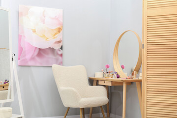 Canvas Print - Mirrors, dressing table with cosmetic products, armchair and folding screen indoors. Interior design