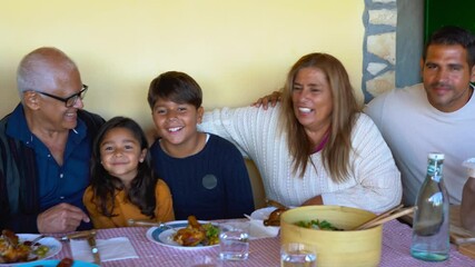 Wall Mural - Happy latin family having fun together after lunch at house patio - Multi generational people 