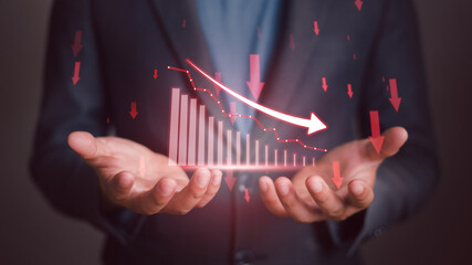 Businessman trade for profit in the stock market the red graph indicates a loss. Stagnation or falling of market.