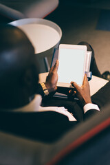 Modern black businessman with tablet