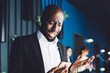 © BullRun - Expressive black businessman with smartphone