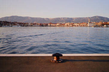 Wall Mural - Iron bollard for mooring of ships at pier. Landscape with sea wharf. Split, Croatia.