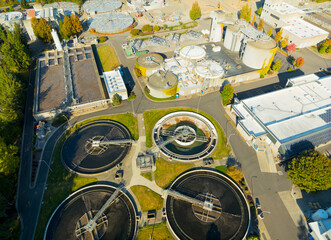 A view of a water treatment plant with three large tanks