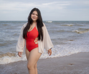 Woman young asian fat chubby cute beautiful smile happy fun enjoy relax freedom bikini swimwear body sexy plus size look sea beach sunset clean blue sky calm nature ocean wave water travel on holiday