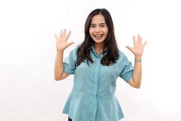 Asian woman smiling in casual apparel with welcome gesture greeting isolated white background