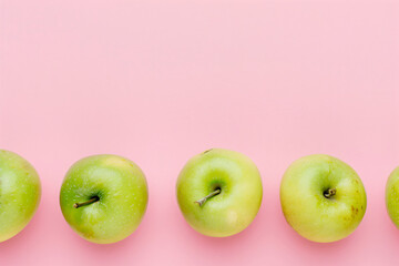 Ripe green apples on a pink background. Design banner template of fresh harvest, for backdrops, wallpapers with copyspace