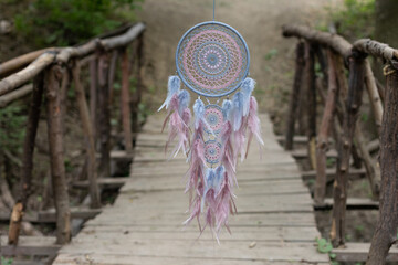 Wall Mural - Handmade dream catcher with feathers threads and beads rope hanging