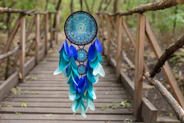 Wall Mural - Handmade dream catcher with feathers threads and beads rope hanging