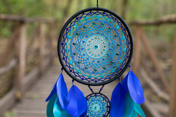 Wall Mural - Handmade dream catcher with feathers threads and beads rope hanging