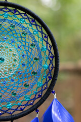 Wall Mural - Handmade dream catcher with feathers threads and beads rope hanging
