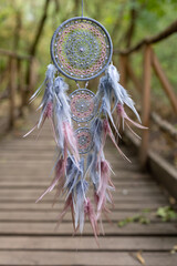 Wall Mural - Dream catcher with feathers threads and beads rope hanging. Dreamcatcher handmade