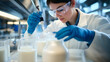 © Prasanth - Food scientist testing milk samples of dairy products in the laboratory. Researchers are looking at the stratification of milk.