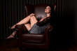 © Tadeusz Ibrom - Beautiful Brunette Woman Sitting in a Chair