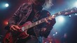 © Alienmarsh - A musician passionately playing electric guitar on stage with dramatic lighting.