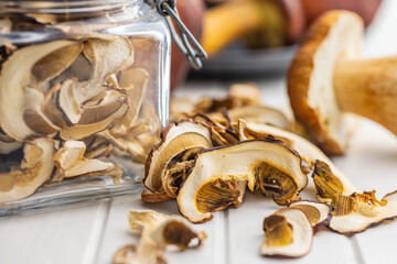 Wall Mural - Dried porcini mushrooms. Sliced boletus on white table.