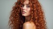 © schiers_images - A stunning woman with long, curly red hair poses in profile. Her elegant style and captivating gaze express beauty and sophistication. Ideal for concepts of style, beauty, and femininity.
