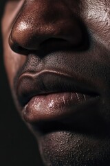 Sticker - Close-up of Lips: A detailed view of textured, dark lips against a black background, evoking emotions and intimacy in photography.