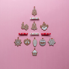 Wall Mural - Christmas tree made of various winter and New Year decoration. Minimal New Year or Christmas concept. Flat lay.