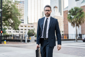 Wall Mural - Walk to success. Hispanic businessman walk in the city. Business man crossing the street. Walk of business man. Businessman in New York. Business success. Businessman in suit walk outdoor