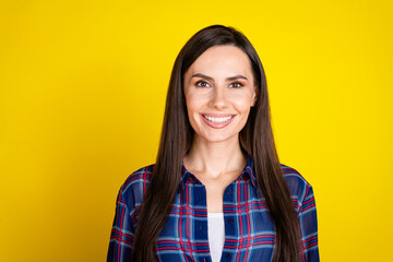 Canvas Print - Photo portrait of attractive young woman toothy smile look camera dressed stylish plaid clothes isolated on yellow color background