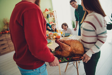 Poster - Photo of happy people christians serving table holiday stuffed baked tasty turkey tradition thanksgiving day indoors