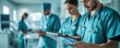 © ImagePulse - Medical professionals wearing scrubs, managing patient data on tablets in a high-tech hospital environment healthcare management, diversity