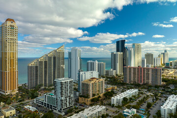 Canvas Print - Sunny Isles Beach city with luxurious highrise hotels and condo buildings on Atlantic ocean shore. American tourism infrastructure in southern Florida