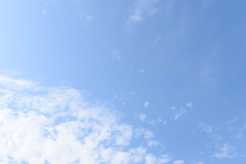 Wall Mural - beautiful blue sky and white fluffy group of clouds with sunrise in the morning, natural background