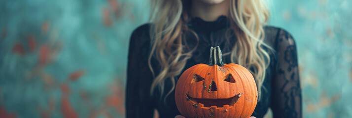 woman in black lace dress holds carved pumpkin, embodying spirit of Halloween. vibrant orange contrasts beautifully with soft background, creating festive atmosphere