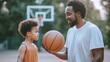 © DigitalMagicVisions - Father Teaching Son Basketball Skills Outdoors