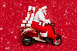 © deagreez - Profile side view of nice bearded focused funky fat Santa riding moped pile stack winter fairy purchases isolated on bright vivid shine vibrant red color background