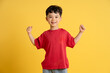 © STOCK88PHOTOGRAPHER - image of asian boy posing on yellow background