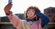 © CineLens2024/peopleimages.com - Outdoor selfie, woman and vacation in city, photography and confident for street fashion. Female person, fun and urban trip on holiday for profile picture, style and social media post on weekend