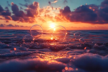 Wall Mural - Bubbles float over the ocean waves at sunset.