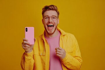 Enthusiastic man presenting a popular new gadget in a contemporary retail setting, vibrant solid backdrop, focusing on tech excitement