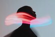 © Papukos - Young woman experiencing sensory overload with light trails