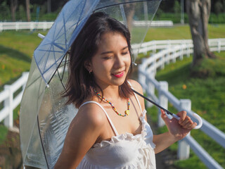 Relax concepts, Beautiful teenage girl on a bright day at a public park in Chiang Mai, Thailand.