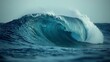 © Lifia - Large ocean wave rolling toward the shore captured in soft morning light