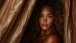 © JoxyAimages - A portrait of a woman with curly hair peering through luxurious brown fabric, showcasing elegance and depth, captured in warm sunlight and shadow interplay.