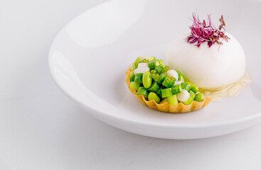 Gourmet appetizer with vegetables and creamy mousse on white plate