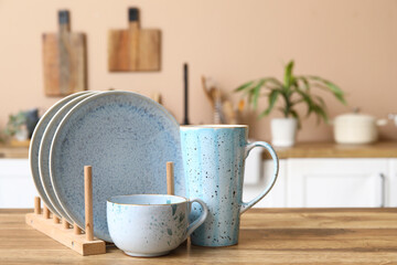 Wall Mural - Beautiful clean dishes on table in kitchen, closeup