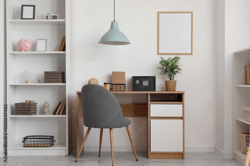 Interior of modern home office with safe on wooden table