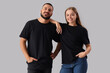 © Pixel-Shot - Young couple in stylish black t-shirts on grey background