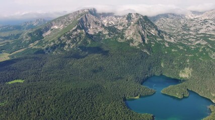 Wall Mural - aerial view of famous black lake in mountain durmitor park at summer, montenegro, 4k