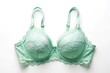 © Hugnaka - Minimalist mint color bra with laces isolated on white background