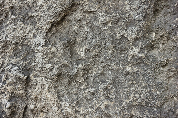 texture of stone surface. close-up of grey surface of hewn stone