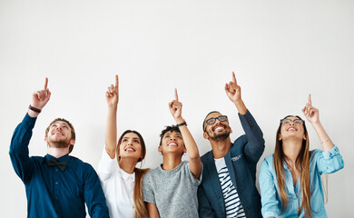 business people, smile and group pointing up for mockup, wall and white background space. creative e