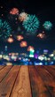 © Nicolai - wooden table top with a blurred city night view and colorful fireworks in the sky